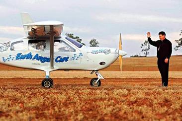 Heaven's above � Father John Fowles with the plane assembled
by parishioners for a fund-raising trip around Australia.