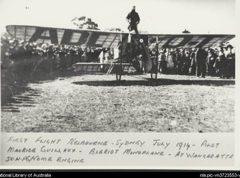  First flight from Melbourne to Sydney showing pilot Maurice Guillaux standing on a Bleriot monoplane with a 50 horsepower Gnome engine, Wangaratta, July 1914 [picture].
