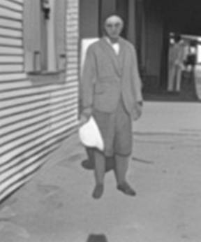 A person standing outside a building

AI-generated content may be incorrect.