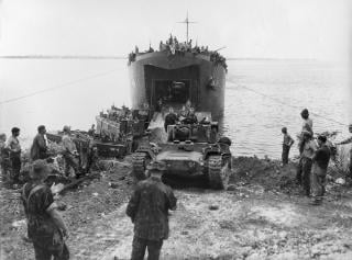 Squarepeg’s D-Day landings on Nissan Island were virtually flawless, with Kiwis and their equipment disembarking and being unloaded from sequentially arriving waves of landing craft and ships. Above: U.S. sailors and New Zealand soldiers watch as a Mk IIICS Valentine tank rumbles ashore from LST-446.