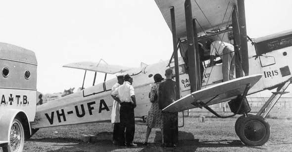 A group of people standing next to an airplane
AI-generated content may be incorrect.