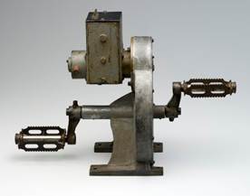 B2125 Pedal generator, brass / steel / paint, designed by Alfred Traeger, unknown maker, used by the Flying Doctor Service, Cloncurry area, Australia c 1930 - 1940. Click to enlarge.